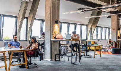 Multiracial group in open loft-style office