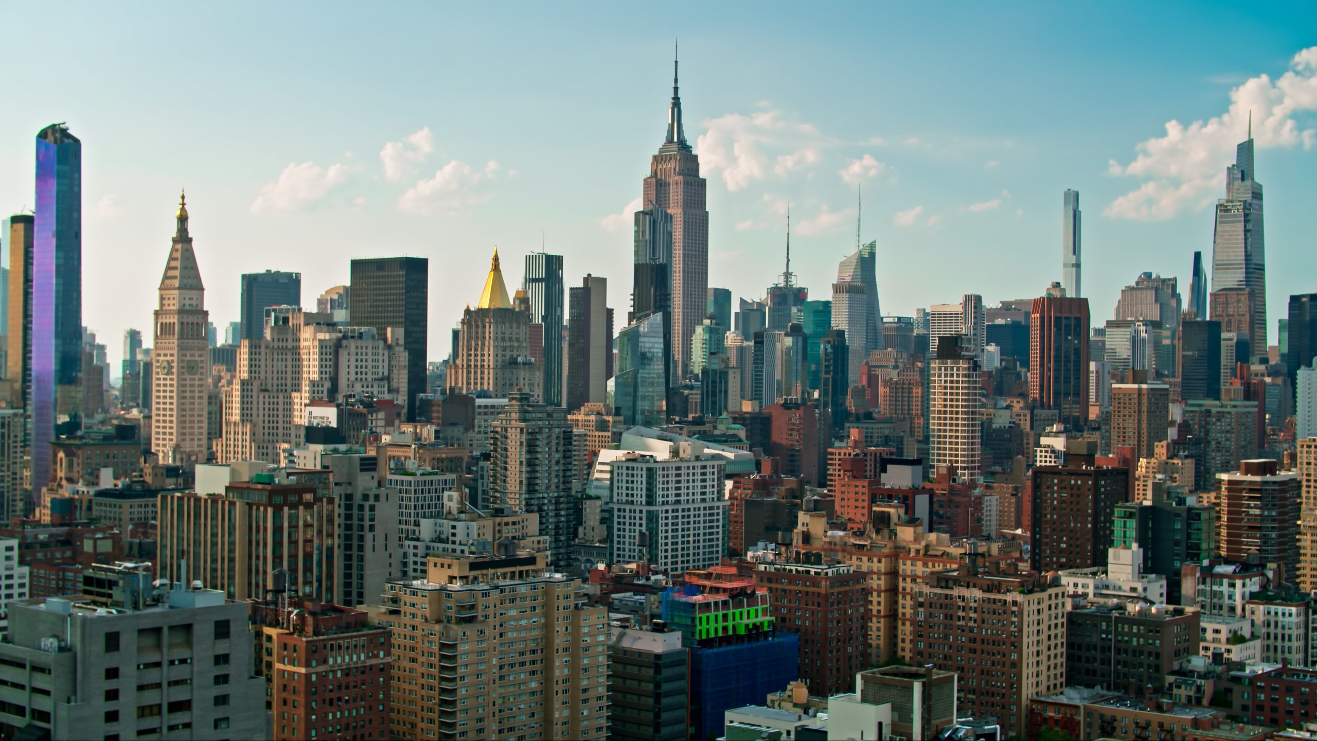Sunny evening view of Manhattan, highlighting NYC's prime commercial real estate landscape.