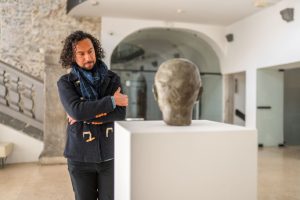 Art dealer in a gallery space