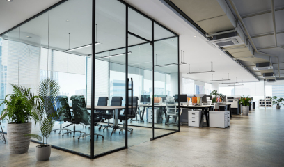 Modern law office with glass partitions and bright work area.