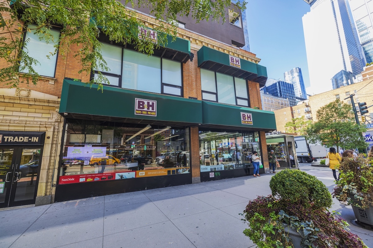 Street view of B&H Photo Video store with green awnings.