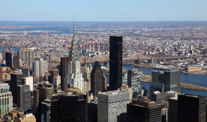 Aerial view of Midtown Manhattan and Chrysler Building on clear day.
